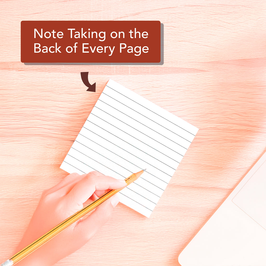 A hand writes on the 2026 A Verse A Day Calendar by HannahFaithstore, its label stating "Note Taking on the Back of Every Page," with a laptop partly seen to the right.