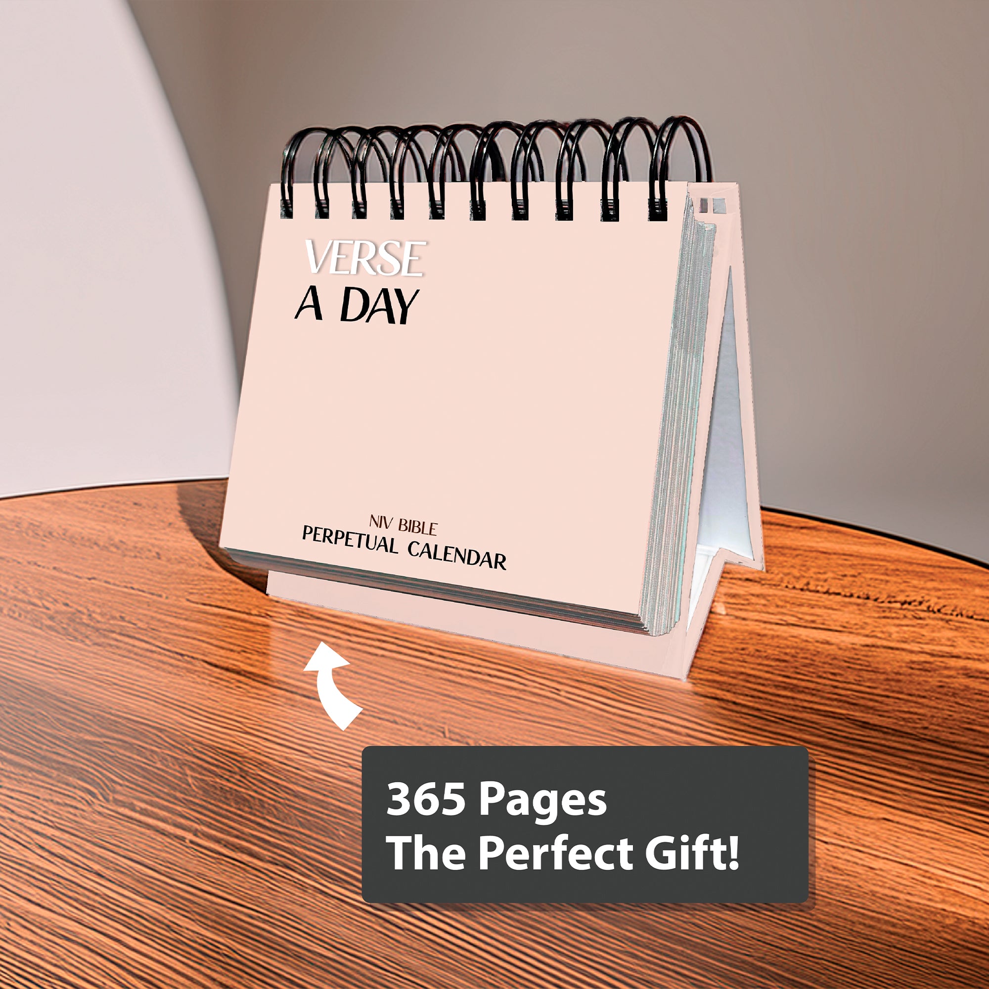 A spiral-bound Religious Perpetual Calendar by HannahFaithstore sits on a wooden table, featuring the text “365 Pages The Perfect Gift!”.
