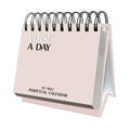 The HannahFaithstore Religious Perpetual Calendar is a spiral-bound desk calendar with a pale pink cover, featuring inspirational daily verses for motivation.