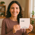 A woman smiles and holds up a HannahFaithstore Religious Perpetual Calendar in a cozy, warmly lit living room with plants and shelves in the background.