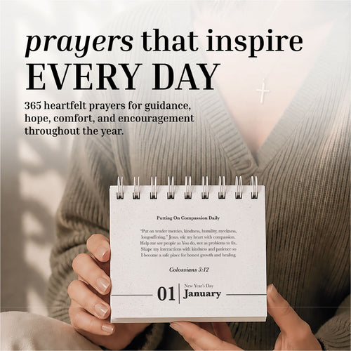 A person holds a cross necklace and has the HannahFaithstore Perpetual Prayer A Day Calendar open to January 1, featuring prayers for guidance, hope, and encouragement.